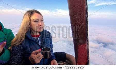 Woman Eat Sandwich And Drinks Tea And Coffee In Flight. Adventure On Hot Air Balloon. Fly In Morning