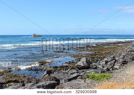 Stony Beach At Playa De Las Americas On Canary Island Tenerife With Blue Water And Blue Sky