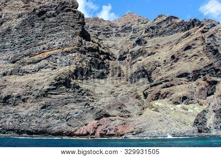 View On The Steep Coast Of Los Gigantes On Canary Island Tenerife With Rocks In Different Colors