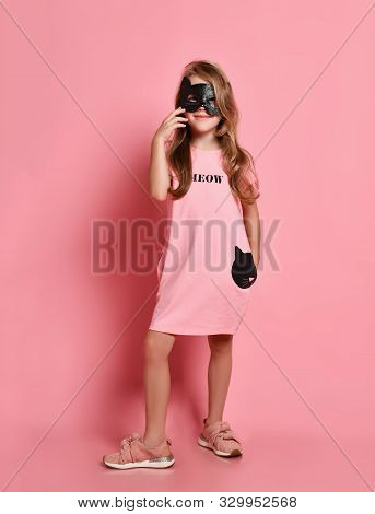 Christmas And New Year Concept. Pretty Kid Girl Blonde With Long Wavy Hair In Cat Mask And Cute Pink