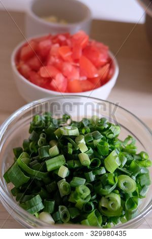 Vertical Row Of Bowls Of Minced Vegetables