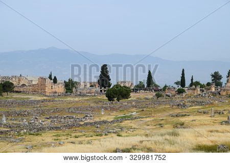 Antique Ruins And Limestone Blocks In Hierapolis, Turkey. Ancient Antique City.