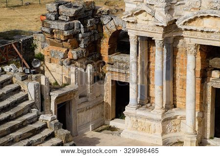 Antique Columns And Arches In The Hierapolis Amphitheater. Ancient Antique Amphitheater In The City 