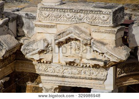 Bas-reliefs Of Antique Scenes On The Gables Of The Amphitheater In Hierapolis, Turkey. Ancient Antiq