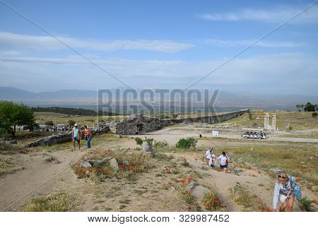 Pamukkale, Hierapolis, Turkey - May 22, 2019: Tour Groups On The Ruins Of Hierapolis. Tourists Are S