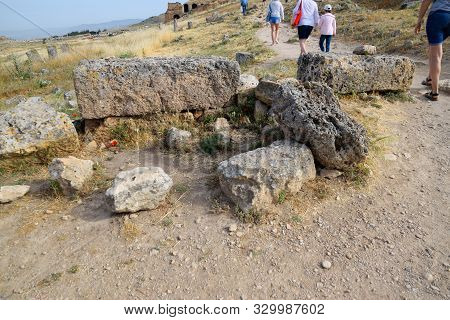 Pamukkale, Hierapolis, Turkey - May 22, 2019: Tour Groups On The Ruins Of Hierapolis. Tourists Are S