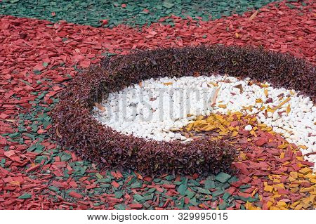 Red Wood Chips. White Stones For Decoration Of Flower Beds. Colored Decorative Wood Chips Closeup Ba