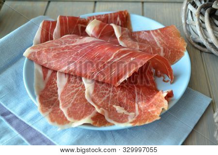 Portion Of Sliced Ham On Blue Plate, Rustic Style