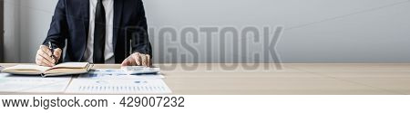 Businessman Sits In A Private Office At His Company And Is Reviewing Company Financial Documents, Se
