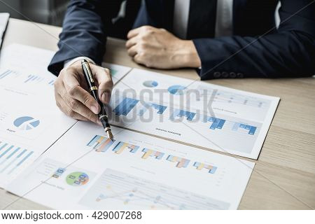 Businessman Sits In A Private Office At His Company And Is Reviewing Company Financial Documents, Se