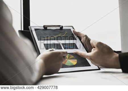 The Head Of The Finance Department Presents The Financial Information To The Executives, The Company