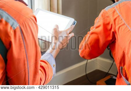 Internet Technician Man Checking Speedtest Upload And Download With Tablet, Technicians Team Install