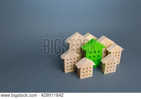 The Green Building Stands Out Among The Houses. Search For The Best Option. Ideal Property To Buy. N