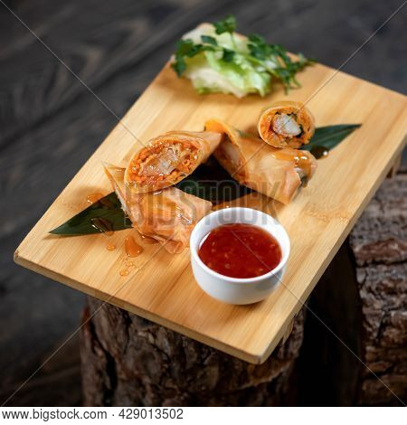 Springrolls, Oriental Rolls With Red Sauce. Pan-asian Or Chinese Food On Wooden Cutting Board. Soft 