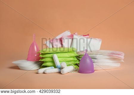 Menstrual Pads And Other Period Products On Pale Orange Background