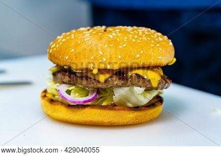 Full Length View Of The Fresh Burger With Meat Patty. Big Appetizing Burger With Meat Cutlet. Unheal