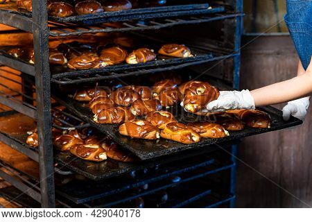 Fresh Crusty Bakery Products Taking From Oven. Hot Tasty Loaf Of Bread.