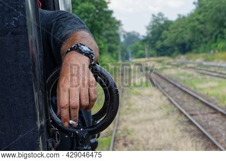 Neuf-brisach, France, June 27, 2021 : Hand Of A Volunteer Who Operates Old Steam Or Electric Locomot