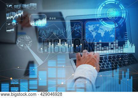 Businessman Working In Front Of Laptop, Blue Hologram Glowing Digital Information Security Interface
