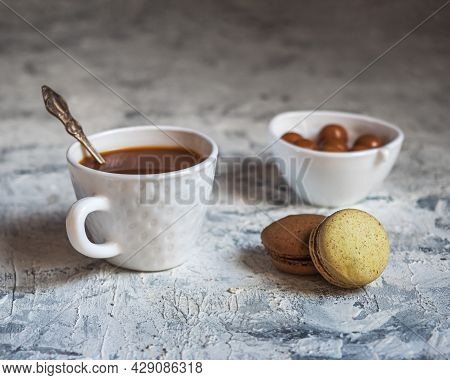 Coffee With Caramel And Cookies In A White Dish On A White Table