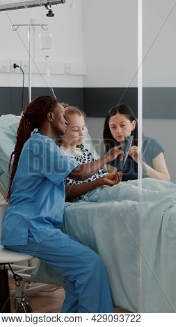 African American Nurse Showing Lungs Radiography Explaining Breathing Disease Symptoms Discussing Re