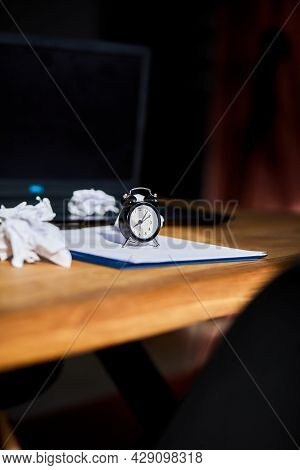 Modern Workplace, Wooden Office Desk In Hardlight, Sunligt With Clock, Sheet Of Paper