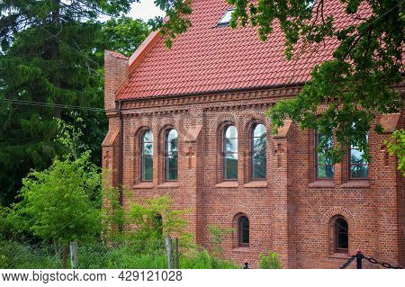 Old Red Bricks Church In Krasnolesye Village (former Gross Rominten) Of Kaliningrad Oblast, Russia. 
