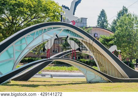 Yesan-gun, South Korea; July 30, 2021: Structure Resembling Egrets Perched On Bridge At Entrance To 