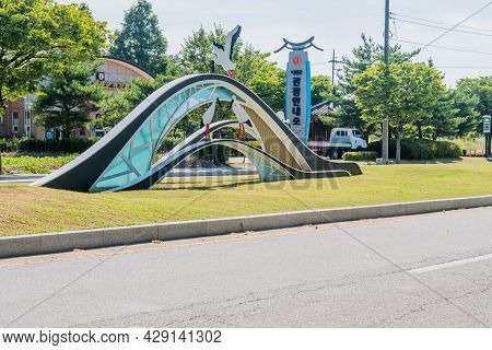 Yesan-gun, South Korea; July 30, 2021: Structure Resembling Egrets Perched On Bridge At Entrance To 