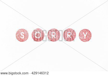 Red Color Rubber Stamp In Word Sorry On White Paper Background