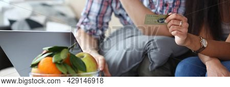Man And Woman Make An Online Purchase Over Internet