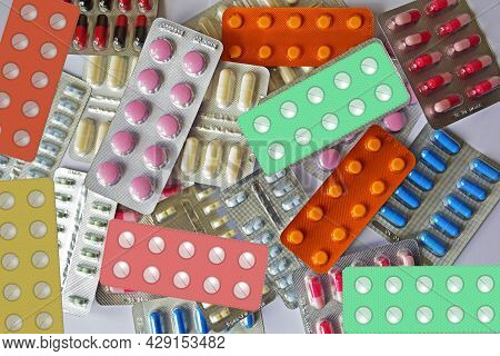 A Pile Of Pills In Blister Packs. Pharmaceutical Blister Pack Close Up. Pack Of Pills With Tablets. 
