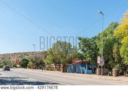Smithfield, South Africa - April 23, 2021: A Street Scene, With Businesses, People And A Vehicle, In