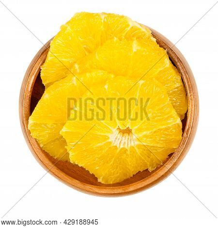Peeled Orange, Cross Section Slices, In A Wooden Bowl. Sliced, Fresh And Ripe Orange, Cut Sweet Frui