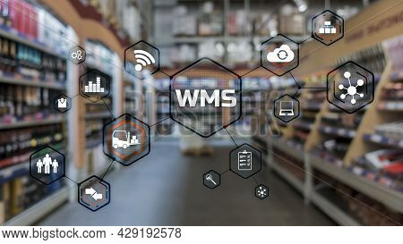 Inscription Wms On Blurred Warehouse Background. Werehouse Management System