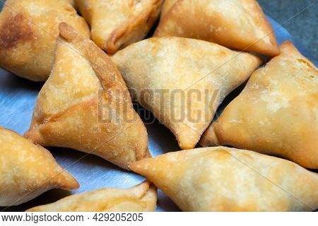 Homemade Samosa, Samsa Or Smosa. A Vegetarian Spicy Indian Special Traditional Street Food. Iftaari 