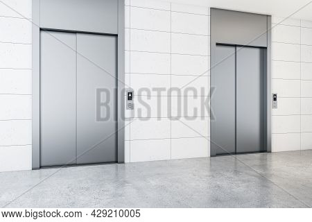 Modern Office Lobby Interior With Steel Elevators, Concrete Flooring And Tile Wall. 3d Rendering
