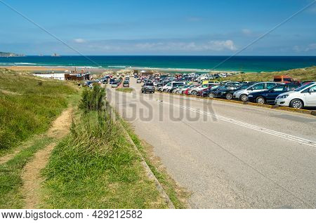 Liencres, Spain - July 10, 2021: Full Beach Parking Lot In Summer, Valdearenas Beach In The Liencres