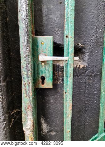 Close Up Of A Metal Lock At A Closed Door