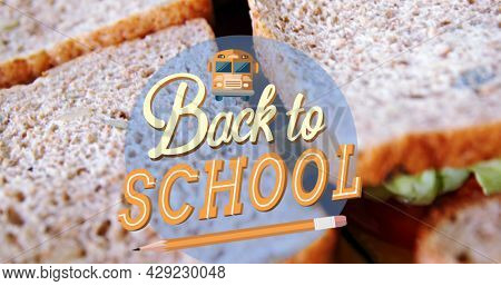 Image of back to school text over sandwiches. education, development and learning concept digitally generated image.