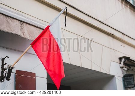 Warszawa Polish Flag With Funeral Strips. Honoring The Memory Of The Victims. National Mourning. Pol