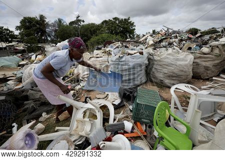 Elderly Collecting Waste For Recycling