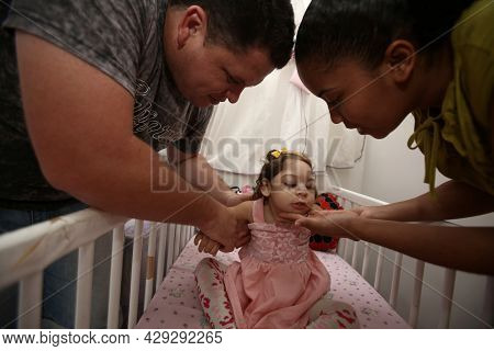 Mother With Daughter With Microcephaly