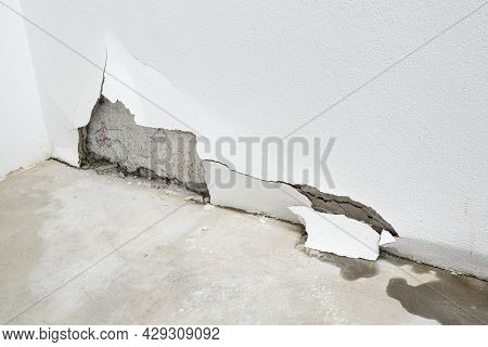 Building Exterior Wall Damaged By Water Leaks. Rain Water Leakage