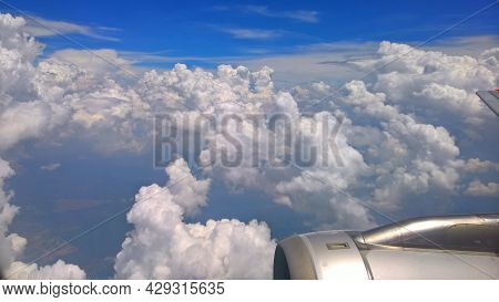 Beautiful White Clouds And Raincloud In Blue Sky View From A Plane, Look Over Pulau Tinggi Island, M