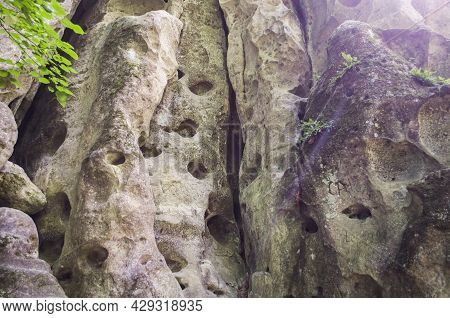 Entrance To The Limestone Cave In The Form Of A Vulva. Natural Nature Photo.