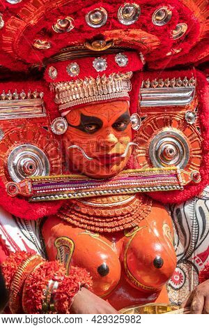 Payyanur, India - December 5, 2019: Portrait of an unidentified Theyyam dancer during temple festival in Payyanur, Kerala, India. Theyyam is a popular ritual form of worship in Kerala, India