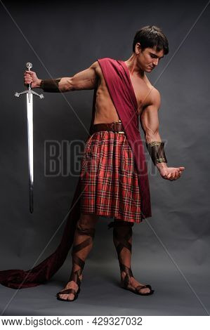 The Sexy Warrior Poses For The Photo.