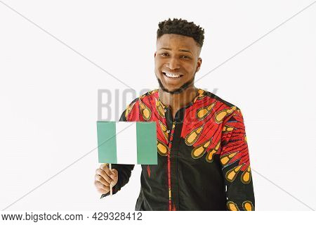 Afrcian Man In Traditonal Clothes With National Flag On White