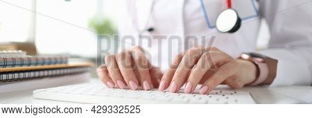 Doctor Hands On White Keyboard. Getting Medical Education